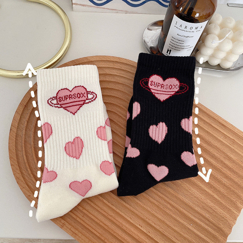 Cute black & white Lolita mid-tube socks with heart design, perfect for students and everyday style.