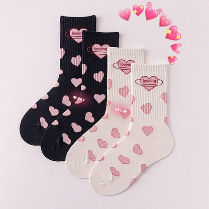 Cute black & white Lolita mid-tube socks with heart pattern, perfect for students and everyday style.