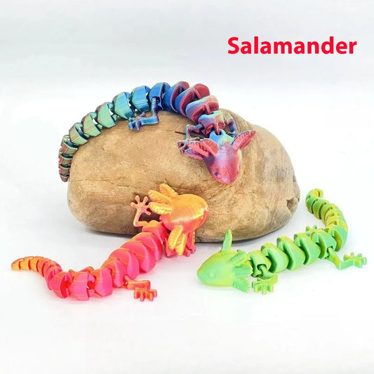 Colorful 3D printed salamander figurines made from PLA wire on rock display.