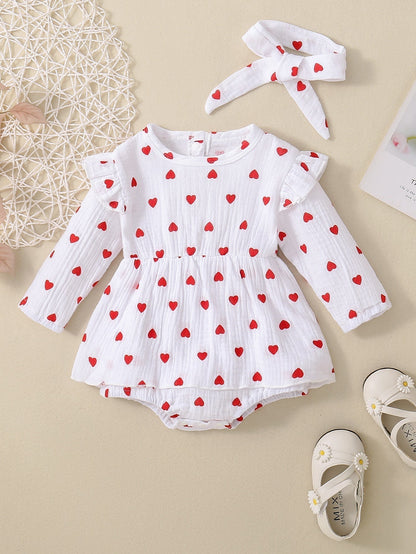 Adorable baby girl Valentine's Day dress with heart pattern, white long-sleeve, cotton fabric.