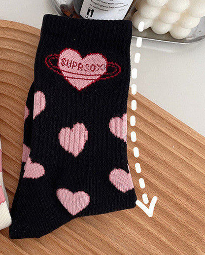Cute black and white Lolita mid-tube socks with heart design, perfect for students and everyday style.