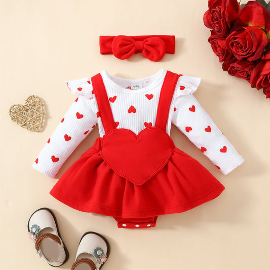 Baby Valentine's Day romper with heart design, fake suspenders, and matching hairband in soft knitted fabric.