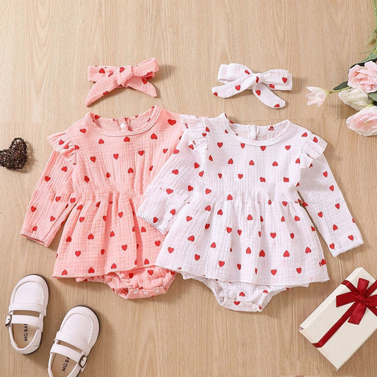 Adorable baby girl's Valentine's Day dress with polka dots in pink and white, long-sleeve, comfortable cotton two-piece set.