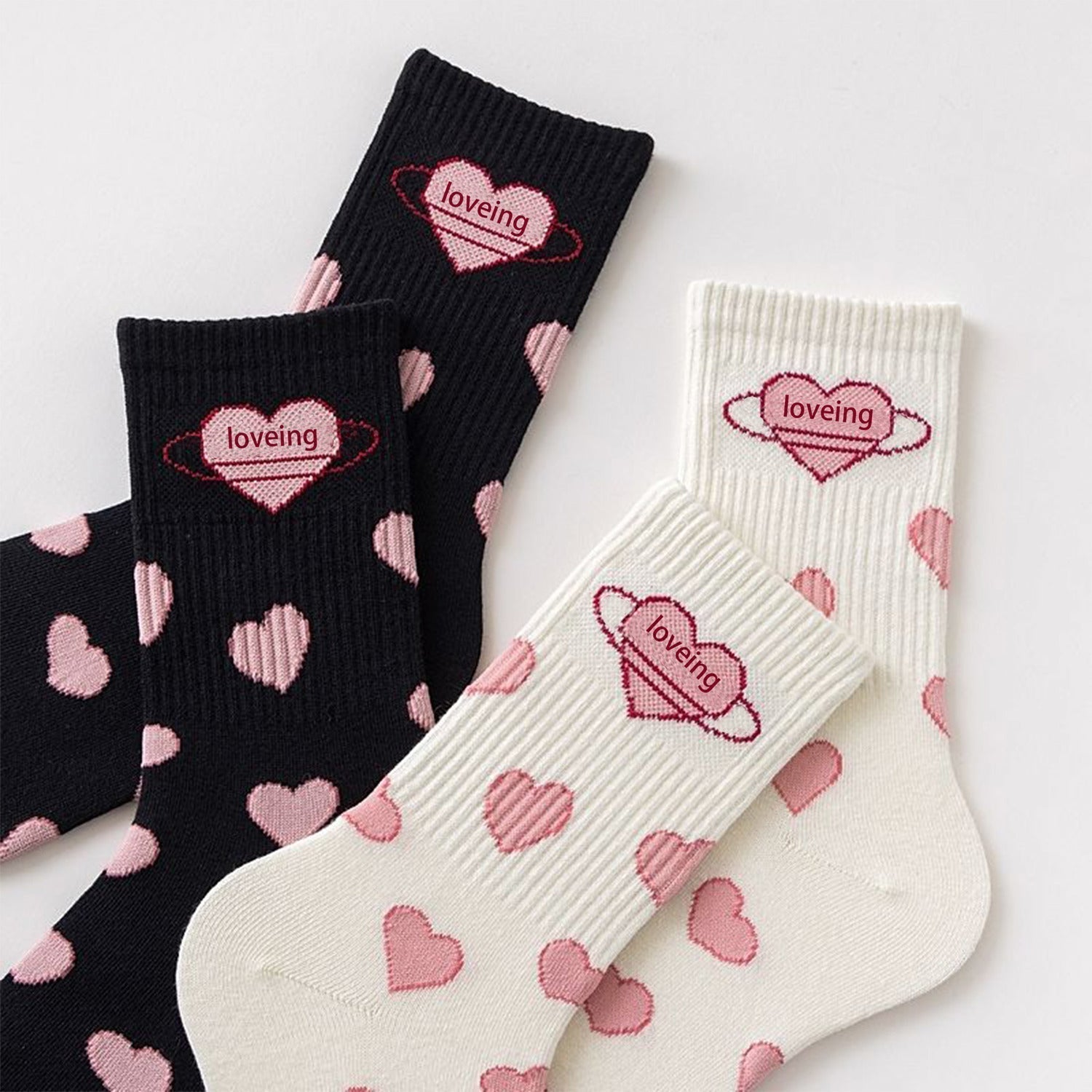 Cute black and white Lolita mid-tube socks with heart designs, perfect for students and everyday style.