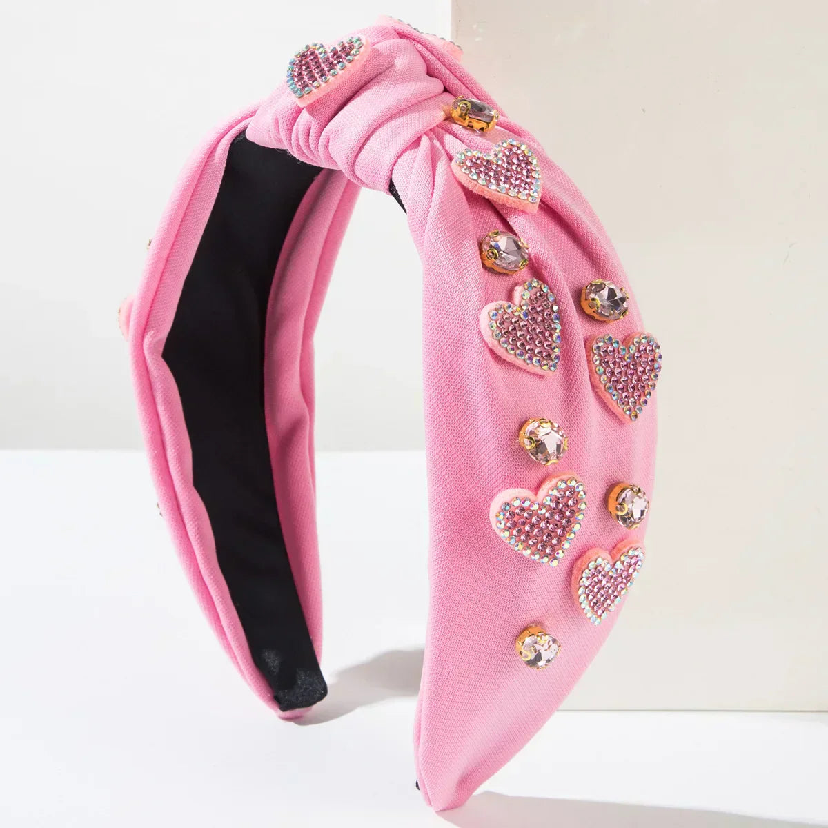 Pink Love Heart Pearl Knot Hairband with rhinestone embellishments, chic and romantic headwear.