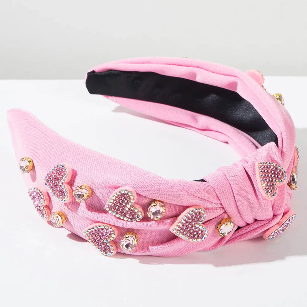 Pink Love Heart Pearl Knot Hairband with rhinestone and pearl embellishments.