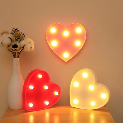 Love Heart LED Lamp illuminating with warm white lights, perfect for romantic night light and decoration.