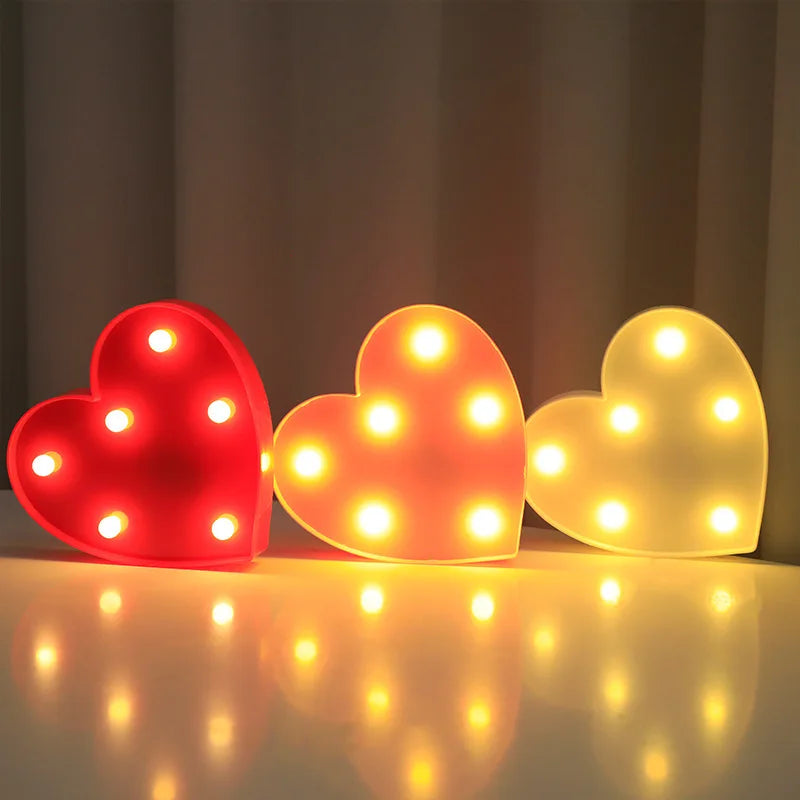 Love Heart LED Lamp glowing on a flat surface; perfect for romantic night settings and cozy home décor.
