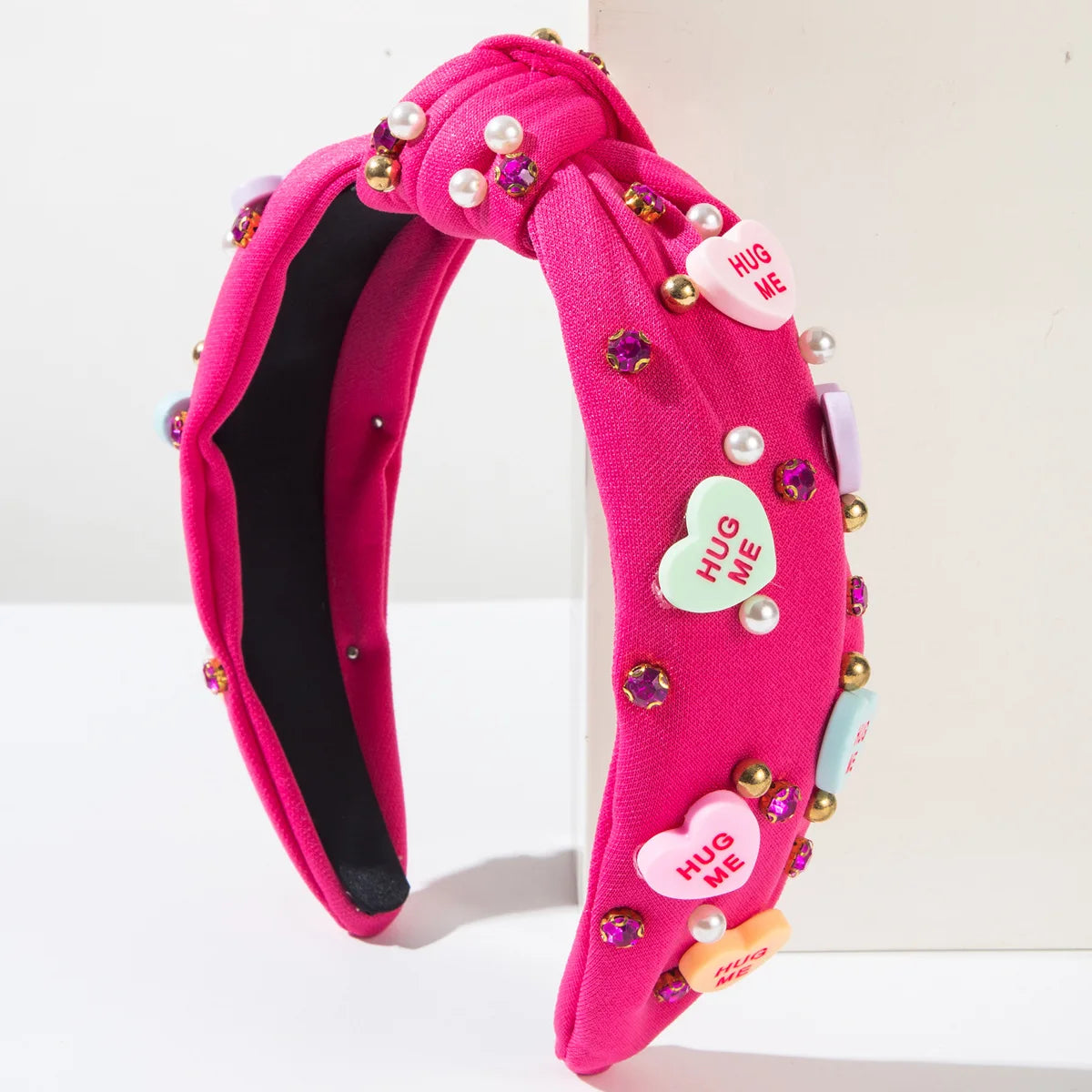Pink Love Heart Pearl Knot Hairband with rhinestones for chic and romantic style.